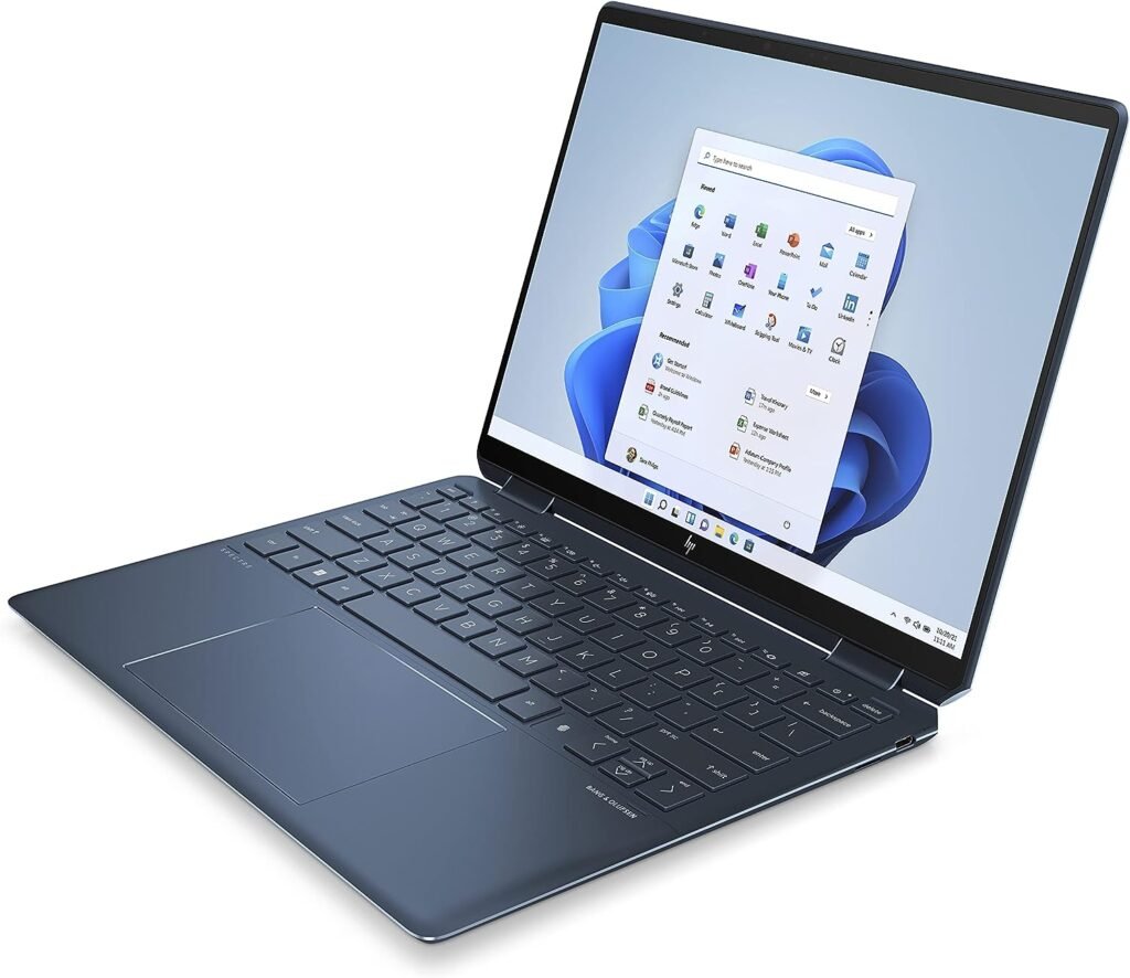 Laptop Hp Spectre abierto con pantalla y teclado retroiluminado