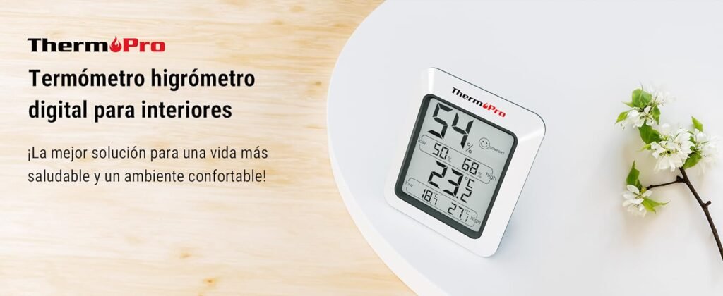 ThermoPro TP50 en ambiente minimalista junto a flores, destacando como el termómetro higrómetro digital interior más efectivo.